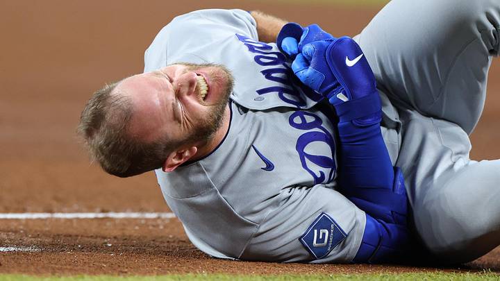 Los Angeles Dodgers third baseman Max Muncy (13) reacts