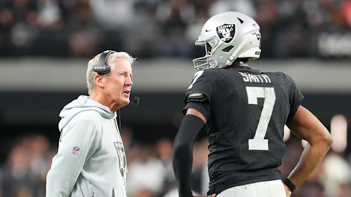 Nov 23, 2025; Paradise, Nevada, USA; Las Vegas Raiders quarterback Geno Smith (7) talks to head coach Pete Carroll in game against the Cleveland Browns during the fourth quarter at Allegiant Stadium. Mandatory Credit: Stephen R. Sylvanie-Imagn Images Nov 23, 2025; Paradise, Nevada, USA; Las Vegas Raiders quarterback Geno Smith (7) talks to head coach Pete Carroll in game against the Cleveland Browns during the fourth quarter at Allegiant Stadium. Mandatory Credit: Stephen R. Sylvanie-Imagn Images