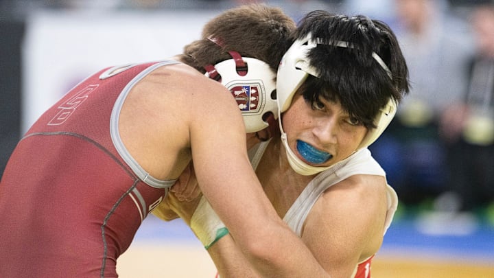 Paulsboro's Will Cruz (right) battles Don Bosco Prep's Will Webb for a takedown during a preliminary round 106-pound bout of the NJSIAA Individual State Wrestling Championships held at Jim Whelan Boardwalk Hall in Atlantic City on March 6. Cruz won by an 8-4 decision.