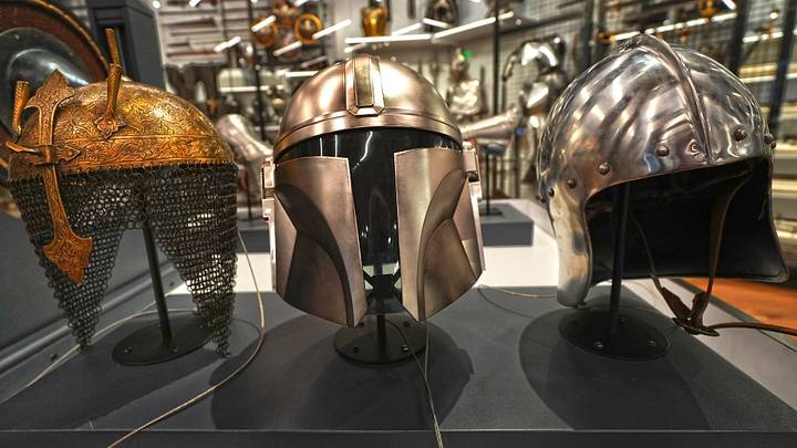 Kulah Khud, Modern reproduction of Indo-Persian style of the 1600s-1800s, Brass with steel mail
Versions of this style of helmet, normally made of steel, were widely popular in Islamic countries from Turkey to India. Its light weight and open face suited a mobile style of warfare that often involved shooting bows from horseback.
Mandalorian Helmet, Star Wars™, Hasbro Inc., Corinthian Helmet. Greek, about 600-550 BCE.
In the Star Wars universe, Mandalorians are a warrior people bound by a Kulah Khud, Modern reproduction of Indo-Persian style of the 1600s-1800s, Brass with steel mail
Versions of this style of helmet, normally made of steel, were widely popular in Islamic countries from Turkey to India. Its light weight and open face suited a mobile style of warfare that often involved shooting bows from horseback.
Mandalorian Helmet, Star Wars™, Hasbro Inc., Corinthian Helmet. Greek, about 600-550 BCE.
In the Star Wars universe, Mandalorians are a warrior people bound by a