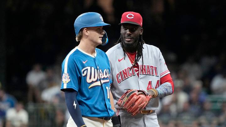 Sep 11, 2026; Milwaukee, Wisconsin, USA;  Milwaukee Brewers shortstop Cooper Pratt (12) and Cincinnati Reds shortstop Elly De La Cruz (44) talk to each other during the second inning at American Family Field.  Mandatory Credit: Michael McLoone-Imagn Images