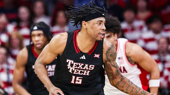 Feb 14, 2026; Tucson, Arizona, USA; Texas Tech Red Raiders forward JT Toppin (15) dribbles the ball during the first half of the game against the Arizona Wildcats at McKale Memorial Center. 