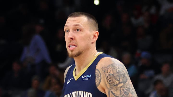 Jan 24, 2025; Memphis, Tennessee, USA; New Orleans Pelicans center Daniel Theis (10) dribbles as Memphis Grizzlies center Zach Edey (14) defends during the third quarter at FedExForum. Mandatory Credit: Petre Thomas-Imagn Images
