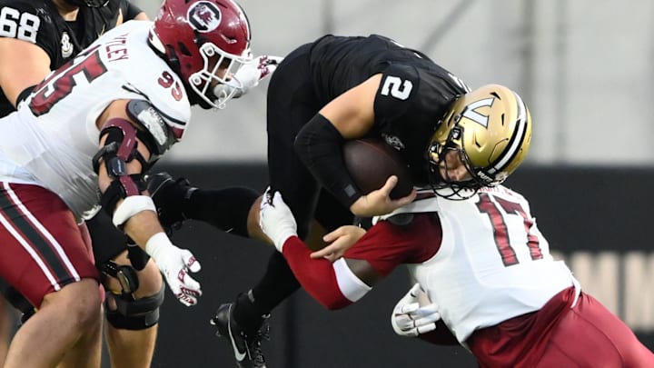 Nov 9, 2024; Nashville, Tennessee, USA; Vanderbilt Commodores cornerback Mark Davis (17) tackles Vanderbilt Commodores quarterback Diego Pavia (2) during the first half at FirstBank Stadium. Nov 9, 2024; Nashville, Tennessee, USA; Vanderbilt Commodores cornerback Mark Davis (17) tackles Vanderbilt Commodores quarterback Diego Pavia (2) during the first half at FirstBank Stadium.