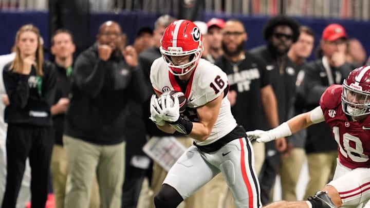 Dec 6, 2025; Atlanta, GA, USA; Georgia Bulldogs wide receiver London Humphreys (16) runs after making a catch as Alabama Crimson Tide defensive back Bray Hubbard (18) defends during the third quarter during the 2025 SEC Championship game at Mercedes-Benz Stadium. Mandatory Credit: Dale Zanine-Imagn Images