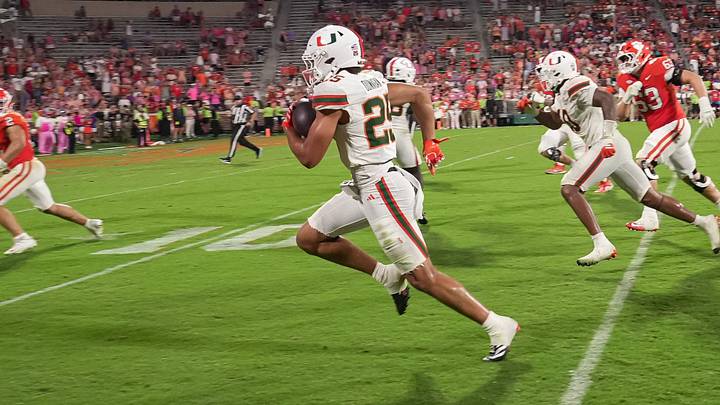 Miami Hurricanes defensive back JJ Dunnigan (25) scores on an interception against Clemson during the fourth quarter at Memorial Stadium Saturday, October 3, 2026. Miami Hurricanes defensive back JJ Dunnigan (25) scores on an interception against Clemson during the fourth quarter at Memorial Stadium Saturday, October 3, 2026.