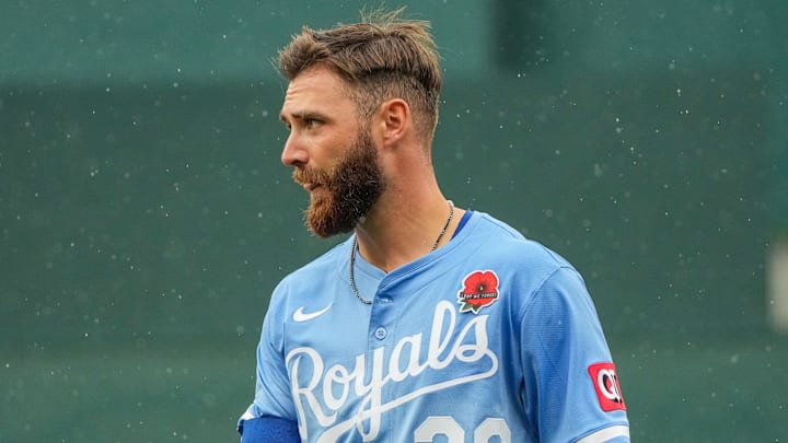 May 26, 2025; Kansas City, Missouri, USA; In his Major league debut, Kansas City Royals right fielder John Rave (26) returns to the dugout against the Cincinnati Reds in the seventh inning at Kauffman Stadium. Mandatory Credit: Denny Medley-Imagn Images