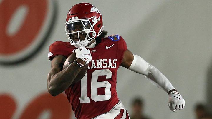 Arkansas Razorbacks defensive back Miguel Mitchell (16) returns an interception during the forth quarter against the Texas Tech Red Raiders at Simmons Bank Liberty Stadium. Arkansas Razorbacks defensive back Miguel Mitchell (16) returns an interception during the forth quarter against the Texas Tech Red Raiders at Simmons Bank Liberty Stadium.