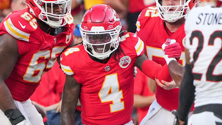 Sep 15, 2024; Kansas City, Missouri, USA; Kansas City Chiefs wide receiver Rashee Rice (4) is helped up by guard Trey Smith (65) against the Cincinnati Bengals after a penalty during the second half at GEHA Field at Arrowhead Stadium. Mandatory Credit: Denny Medley-Imagn Images Sep 15, 2024; Kansas City, Missouri, USA; Kansas City Chiefs wide receiver Rashee Rice (4) is helped up by guard Trey Smith (65) against the Cincinnati Bengals after a penalty during the second half at GEHA Field at Arrowhead Stadium. Mandatory Credit: Denny Medley-Imagn Images
