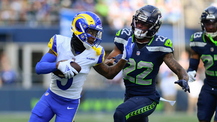 Sep 10, 2023; Seattle, Washington, USA; Los Angeles Rams wide receiver Tutu Atwell (5) carries the ball after a catch while Seattle Seahawks cornerback Tre Brown (22) chases during the second half at Lumen Field. Mandatory Credit: Steven Bisig-Imagn Images