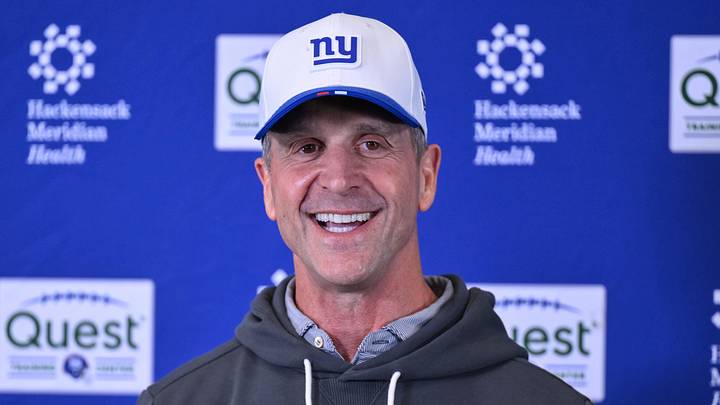 New York Giants head coach John Harbaugh speaks at a press conference during organized team activities.