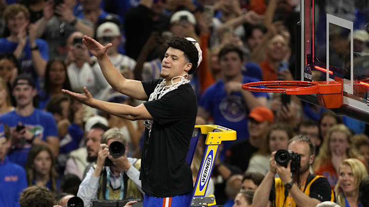 Apr 7, 2025; San Antonio, TX, USA; Florida Gators guard Walter Clayton Jr. (1) cuts the net after defeating the Houston Cougars in the national championship game of the Final Four of the 2025 NCAA Tournament at the Alamodome.Mandatory Credit: Scott Wachter-Imagn Images