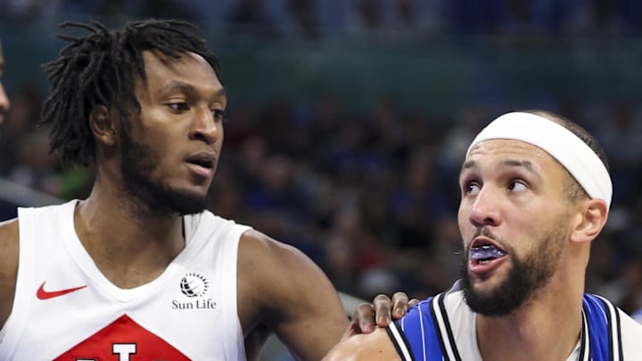 Orlando Magic guard Jalen Suggs looks to shoot the ball defended by Toronto Raptors guard Immanuel Quickley. Orlando Magic guard Jalen Suggs looks to shoot the ball defended by Toronto Raptors guard Immanuel Quickley.