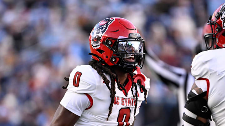 Nov 30, 2024; Chapel Hill, North Carolina, USA; North Carolina State Wolfpack linebacker Sean Brown (0) reacts after recovering a fumble in the first quarter at Kenan Memorial Stadium. Mandatory Credit: Bob Donnan-Imagn Images Nov 30, 2024; Chapel Hill, North Carolina, USA; North Carolina State Wolfpack linebacker Sean Brown (0) reacts after recovering a fumble in the first quarter at Kenan Memorial Stadium. Mandatory Credit: Bob Donnan-Imagn Images