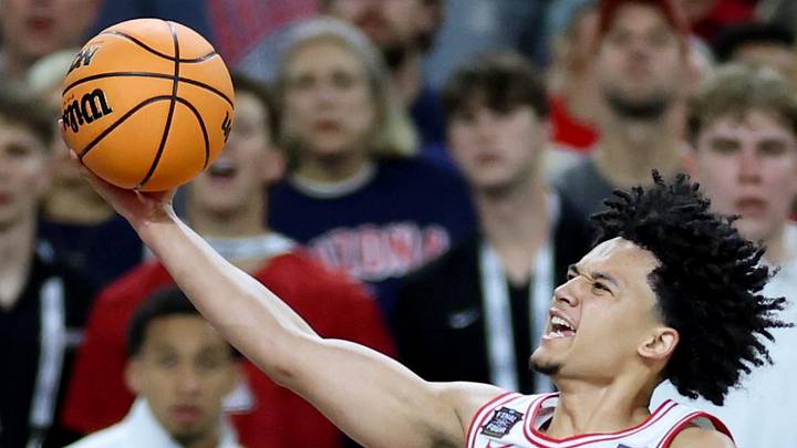 Apr 4, 2026; Indianapolis, IN, USA; Arizona Wildcats guard Brayden Burries (5) goes to the basket against Michigan Wolverines forward Morez Johnson Jr. (21) in the second half during a semifinal of the Final Four of the men's 2026 NCAA Tournament at Lucas Oil Stadium. Mandatory Credit: Trevor Ruszkowski-Imagn Images