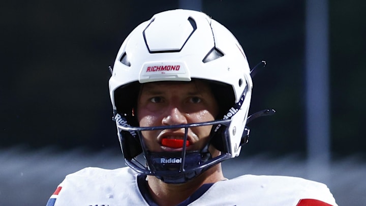 Aug 31, 2024; Charlottesville, Virginia, USA; Richmond Spiders quarterback Kyle Wickersham (16) celebrates after scoring a touchdown against the Virginia Cavaliers during the first half at Scott Stadium. Mandatory Credit: Amber Searls-Imagn Images