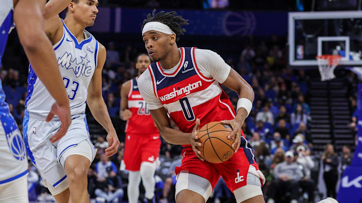 Mar 12, 2026; Orlando, Florida, USA; Washington Wizards guard Bilal Coulibaly (0) drives around Orlando Magic forward Tristan da Silva (23) during the first quarter at Kia Center. Mandatory Credit: Mike Watters-Imagn Images