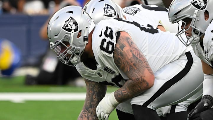 Oct 20, 2024; Inglewood, California, USA; Las Vegas Raiders center Andre James (68) and Las Vegas Raiders guard Jackson Powers-Johnson (58) driving the fourth quarter against the Los Angeles Rams at SoFi Stadium. Mandatory Credit: Robert Hanashiro-Imagn Images