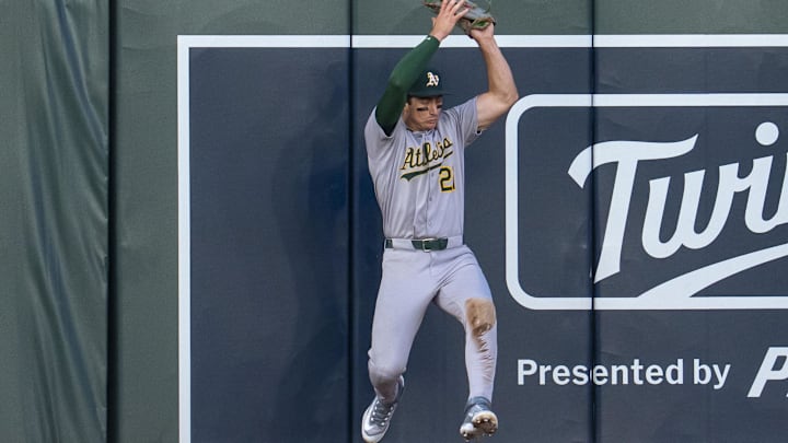 Aug 20, 2025; Minneapolis, Minnesota, USA; Athletics left fielder Tyler Soderstrom (21) jumps up and catches a fly ball against the left field wall against the Minnesota Twins in the fifth inning at Target Field. Mandatory Credit: Jesse Johnson-Imagn Images Aug 20, 2025; Minneapolis, Minnesota, USA; Athletics left fielder Tyler Soderstrom (21) jumps up and catches a fly ball against the left field wall against the Minnesota Twins in the fifth inning at Target Field. Mandatory Credit: Jesse Johnson-Imagn Images