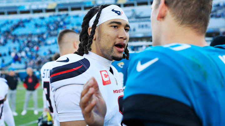 Houston Texans quarterback C.J. Stroud (7), left, talks with Jacksonville Jaguars quarterback Mac Jones (10) after the game of an NFL football matchup Sunday, Dec. 1, 2024 at EverBank Stadium in Jacksonville, Fla. The Texans held off the Jaguars 23-20. [Corey Perrine/Florida Times-Union]