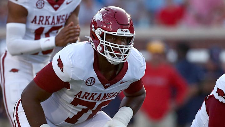 Arkansas Razorback offensive lineman E’Marion Harris (76) waits for the snap during the first quarter against the Mississippi Rebels at Vaught-Hemingway Stadium.