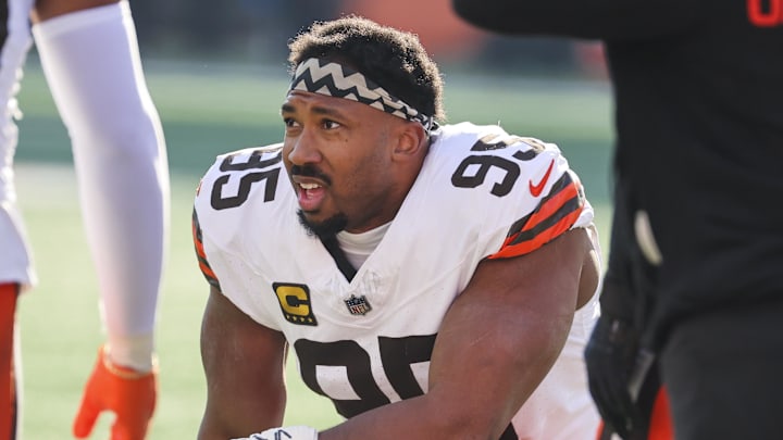 Jan 4, 2026; Cincinnati, Ohio, USA; Cleveland Browns defensive end Myles Garrett (95) kneels on the field during a first half timeout against the Cincinnati Bengals at Paycor Stadium. Mandatory Credit: Joseph Maiorana-Imagn Images