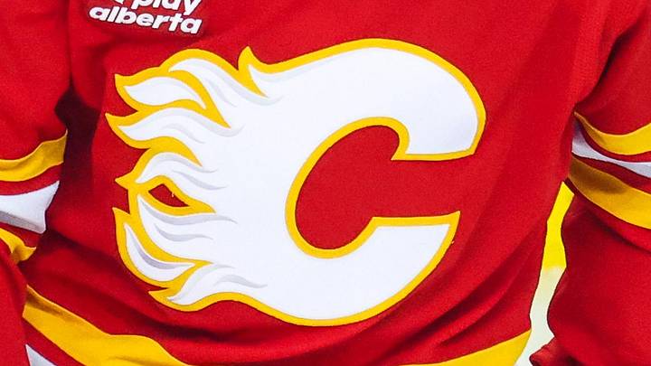 Jan 19, 2026; Calgary, Alberta, CAN; Calgary Flames defenseman Zach Whitecloud (28) skates during the warmup period against the New Jersey Devils at Scotiabank Saddledome. Mandatory Credit: Sergei Belski-Imagn Images