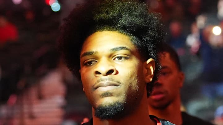 Portland Trail Blazers guard Scoot Henderson greets fans as he walks toward the court.