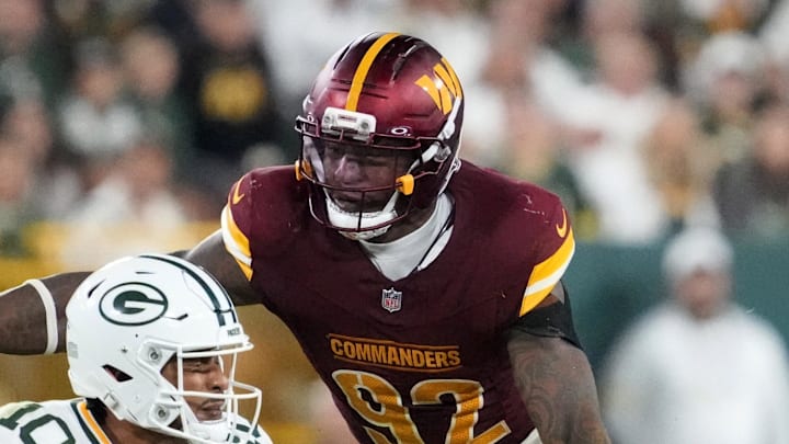 Sep 11, 2025; Green Bay, Wisconsin, USA;  Washington Commanders defensive end Dorance Armstrong (92) sacks Green Bay Packers quarterback Jordan Love (10) in the fourth quarter at Lambeau Field. Mandatory Credit: Jeff Hanisch-Imagn Images