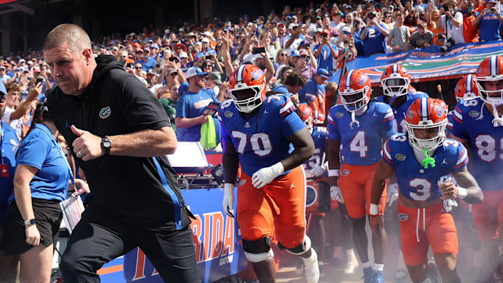 Sep 6, 2025; Gainesville, Florida, USA; Florida Gators head coach Billy Napier and teammates run out of the tunnel prior to the game against the South Florida Bulls at Ben Hill Griffin Stadium. Mandatory Credit: Kim Klement Neitzel-Imagn Images