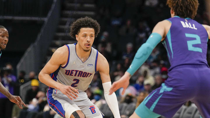 Feb 27, 2022; Charlotte, North Carolina, USA; Detroit Pistons guard Cade Cunningham (2) dribbles against Charlotte Hornets guard LaMelo Ball (2) during the second half at the Spectrum Center. Mandatory Credit: Jim Dedmon-Imagn Imagesthe