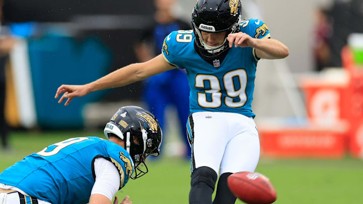 Jacksonville Jaguars place kicker Cam Little (39) kicks a game-winning field goal as punter Logan Cooke (9) holds during the fourth quarter of an NFL football matchup Sunday, Oct. 6, 2024 at EverBank Stadium in Jacksonville, Fla. The Jaguars edged the Colts on a field goal 37-34. [