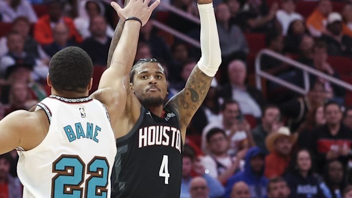 Jan 13, 2025; Houston, Texas, USA; Houston Rockets guard Jalen Green (4) shoots the ball as Memphis Grizzlies guard Desmond Bane (22) defends during the second half at Toyota Center. Mandatory Credit: Troy Taormina-Imagn Images