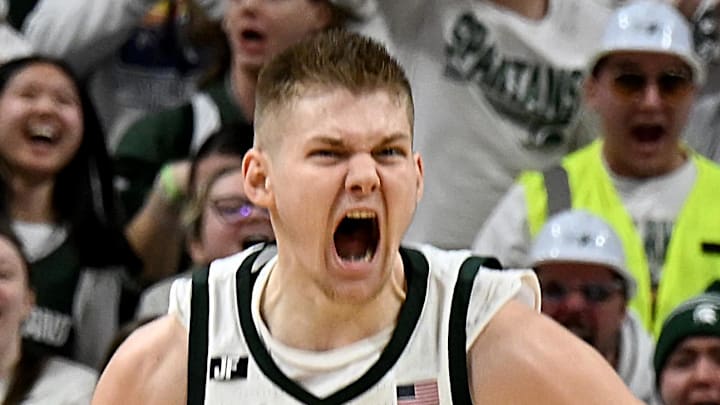 Mar 9, 2025; East Lansing, Michigan, USA; Michigan State Spartans forward Jaxon Kohler (0) celebrates a big basket against the Michigan Wolverines during the first half at Jack Breslin Student Events Center. Mandatory Credit: Dale Young-Imagn Images Mar 9, 2025; East Lansing, Michigan, USA; Michigan State Spartans forward Jaxon Kohler (0) celebrates a big basket against the Michigan Wolverines during the first half at Jack Breslin Student Events Center. Mandatory Credit: Dale Young-Imagn Images
