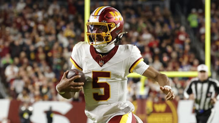 Nov 2, 2025; Landover, Maryland, USA; Washington Commanders quarterback Jayden Daniels (5) runs the ball against the Seattle Seahawks during the first half at Northwest Stadium. Mandatory Credit: Amber Searls-Imagn Images