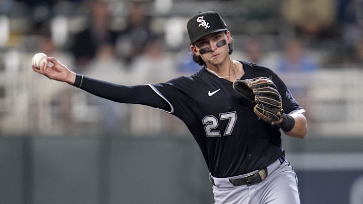 Chicago White Sox second baseman Brooks Baldwin (27) throws the ball to first base against the Minnesota Twins at Target Field. 