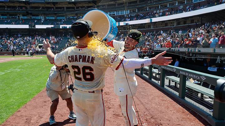 San Francisco, California, USA; San Francisco Giants infielder Willy Adames (2) pours the contents of a beverage cooler over infielder Matt Chapman (26) after the game against the Chicago Cubs at Oracle Park. Mandatory Credit: Robert Edwards-Imagn Images