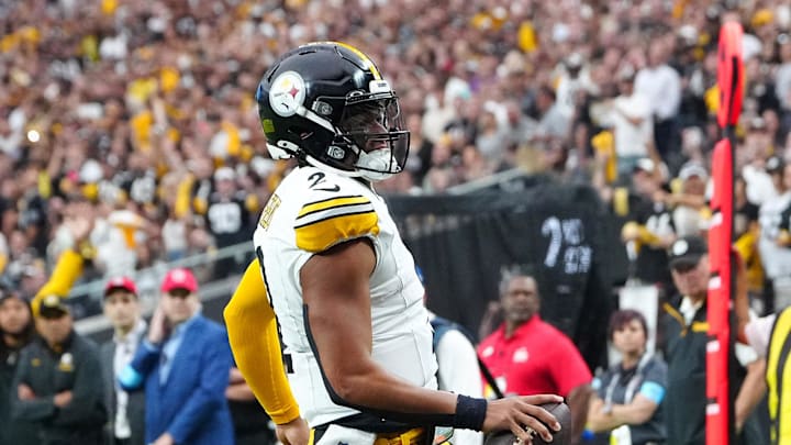 Oct 13, 2024; Paradise, Nevada, USA; Pittsburgh Steelers quarterback Justin Fields (2) scores a rushing touchdown against the Las Vegas Raiders during the second quarter at Allegiant Stadium. Mandatory Credit: Stephen R. Sylvanie-Imagn Images