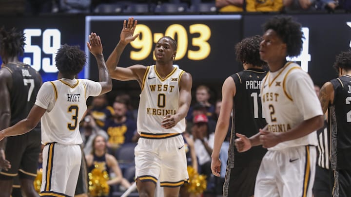 Mar 6, 2026; Morgantown, West Virginia, USA; West Virginia Mountaineers forward Brenen Lorient (0) celebrates with West Virginia Mountaineers guard Honor Huff (3) during the second half against the UCF Knights at Hope Coliseum. Mandatory Credit: Ben Queen-Imagn Images Mar 6, 2026; Morgantown, West Virginia, USA; West Virginia Mountaineers forward Brenen Lorient (0) celebrates with West Virginia Mountaineers guard Honor Huff (3) during the second half against the UCF Knights at Hope Coliseum. Mandatory Credit: Ben Queen-Imagn Images