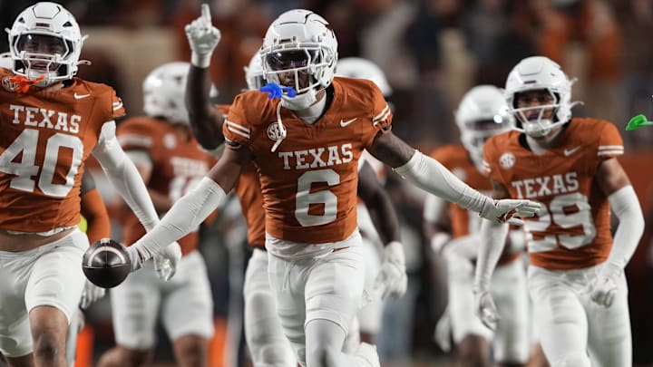 Texas Longhorns cornerback Kobe Black and teammates react after making an interception during the second half against the Texas A&M Aggies at Darrell K Royal-Texas Memorial Stadium.