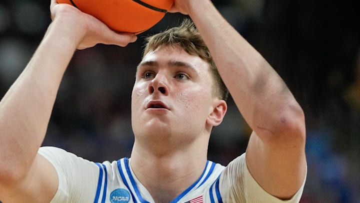 Mar 21, 2025; Raleigh, NC, USA; Duke Blue Devils forward Cooper Flagg (2) shoots a free throw against the Mount St. Mary's Mountaineers during the first half in the first round of the NCAA Tournament at Lenovo Center. Mandatory Credit: Bob Donnan-Imagn Images