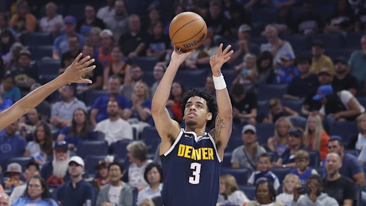 Oct 17, 2025; Oklahoma City, Oklahoma, USA; Denver Nuggets guard Julian Strawther (3) shoots as Oklahoma City Thunder guard Aaron Wiggins (21) defends during the first half at Paycom Center. Mandatory Credit: Alonzo Adams-Imagn Images