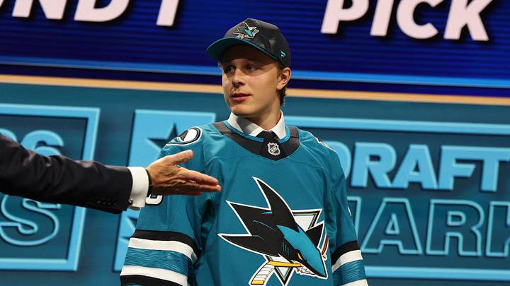 Jun 26, 2026; Buffalo, New York, USA; Ivar Stenberg reacts beside NHL commissioner Gary Bettman after being selected with the second pick in the first round of the 2026 NHL Draft by the San Jose Sharks at KeyBank Center. Mandatory Credit: Timothy T. Ludwig-Imagn Images