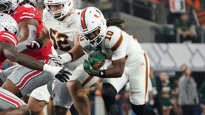 Dec 31, 2025; Arlington, TX, USA; Miami Hurricanes wide receiver Malachi Toney (10) runs the ball in the first quarter against the Ohio State Buckeyes during the 2025 Cotton Bowl and quarterfinal game of the College Football Playoff at AT&T Stadium. Mandatory Credit: Raymond Carlin III-Imagn Images