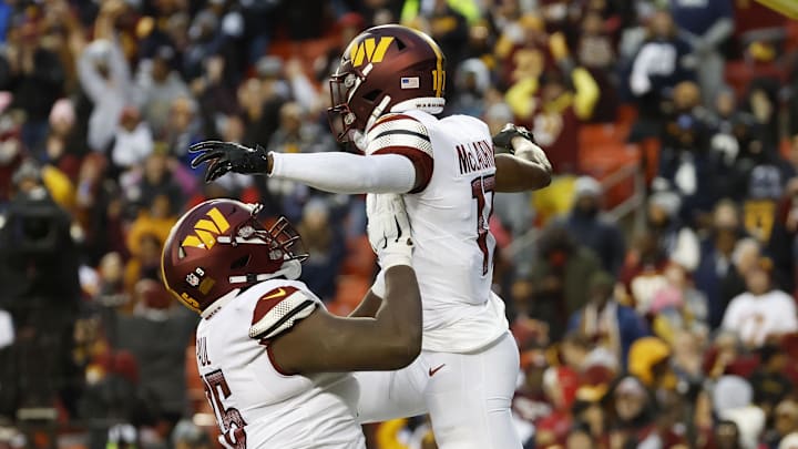 Jan 8, 2023; Landover, Maryland, USA; Washington Commanders wide receiver Terry McLaurin (17) celebrates with Commanders guard Chris Paul (75) after scoring a touchdown against the Dallas Cowboys during the first quarter at FedExField. Mandatory Credit: Geoff Burke-Imagn Images