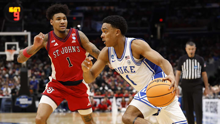 Mar 27, 2026; Washington, DC, USA; Duke Blue Devils guard Caleb Foster (1) dribbles the ball past St. John's Red Storm forward Dillon Mitchell (1) in the second half during a Sweet Sixteen game of the East Regional of the men's 2026 NCAA Tournament at Capital One Arena. Mandatory Credit: Geoff Burke-Imagn Images Mar 27, 2026; Washington, DC, USA; Duke Blue Devils guard Caleb Foster (1) dribbles the ball past St. John's Red Storm forward Dillon Mitchell (1) in the second half during a Sweet Sixteen game of the East Regional of the men's 2026 NCAA Tournament at Capital One Arena. Mandatory Credit: Geoff Burke-Imagn Images