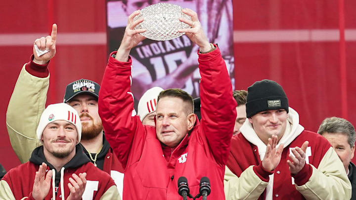 Indiana Hoosiers head coach Curt Cignetti holds up the coaches trophy on Saturday, Jan. 24, 2026, during the Indiana Football College Football Playoff National Championship celebration and parade at Memorial Stadium in Bloomington.