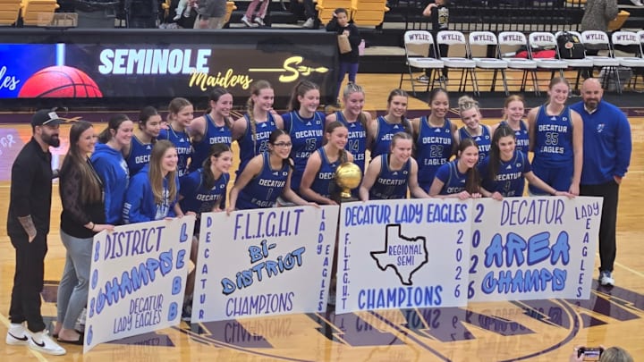 Drew Coffman, far right, was hired as the new women's basketball coach at Midwestern State. 
