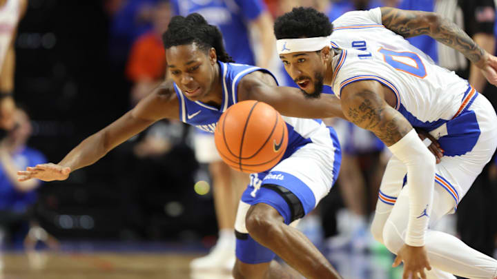 Florida guard Boogie Fland (0) steals the ball from Kentucky guard Jasper Johnson (2) during the first half of a NCAA mens basketball game at Steven C. O'Connell Center Exactek arena in Gainesville, FL on Saturday, February 14, 2026. [Alan Youngblood/Gainesville Sun]