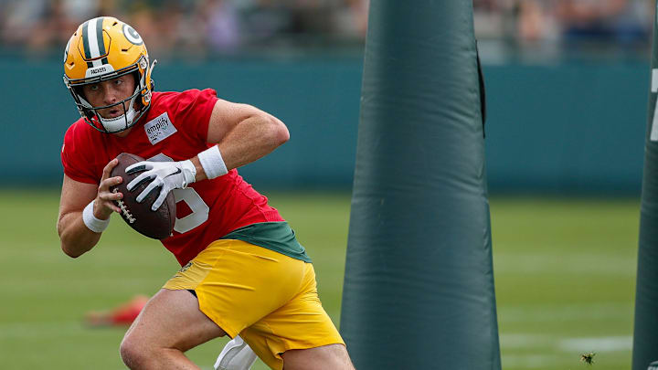 Green Bay Packers quarterback Sean Clifford runs through drills at training camp.